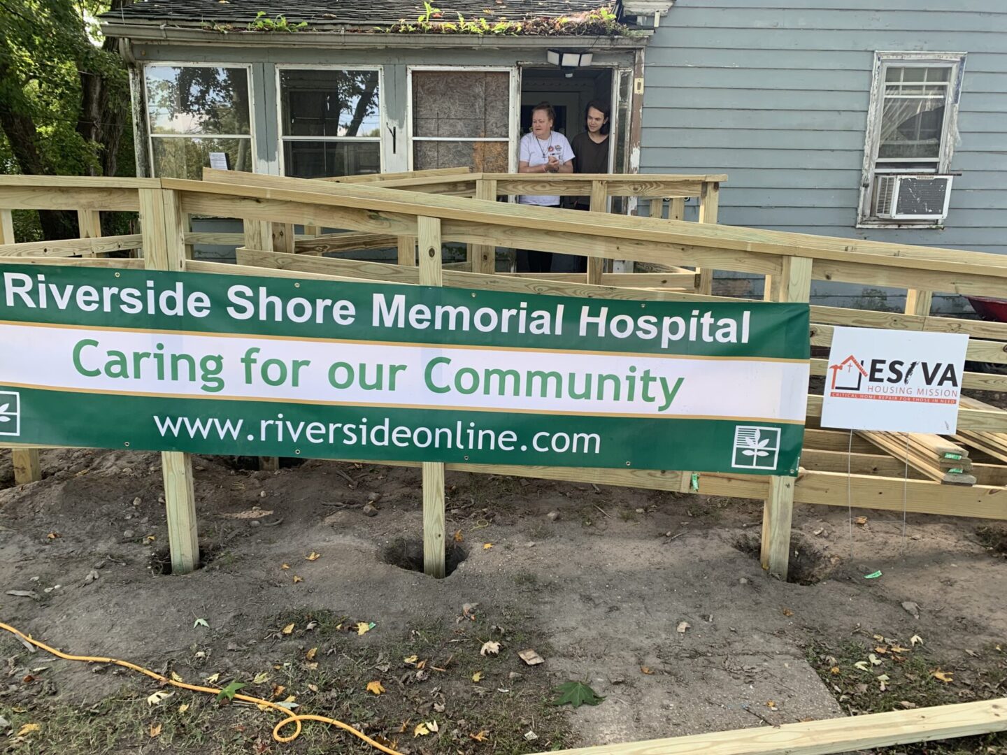Sign promoting Riverside Shore Memorial Hospital's community care.