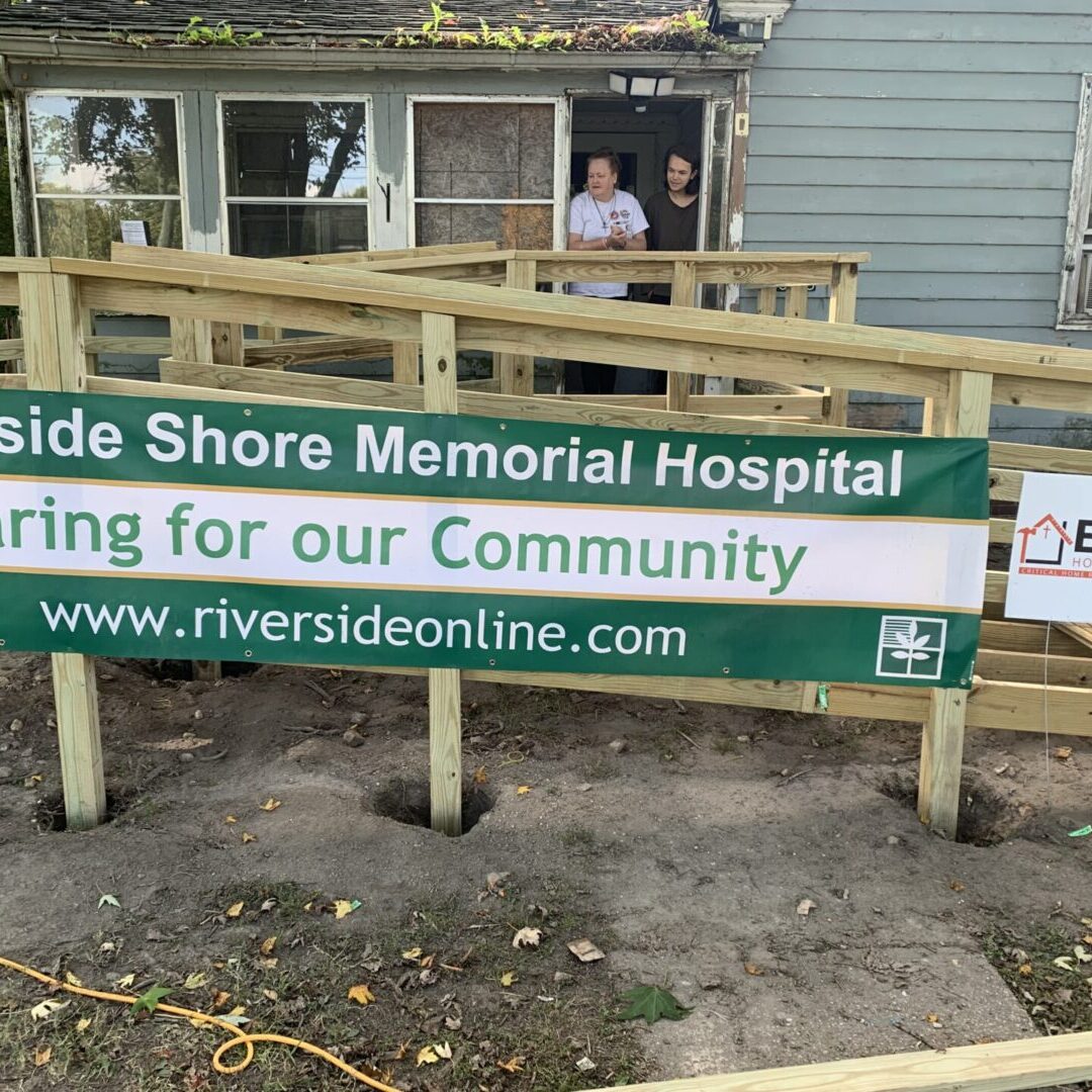 Sign promoting Riverside Shore Memorial Hospital's community care.